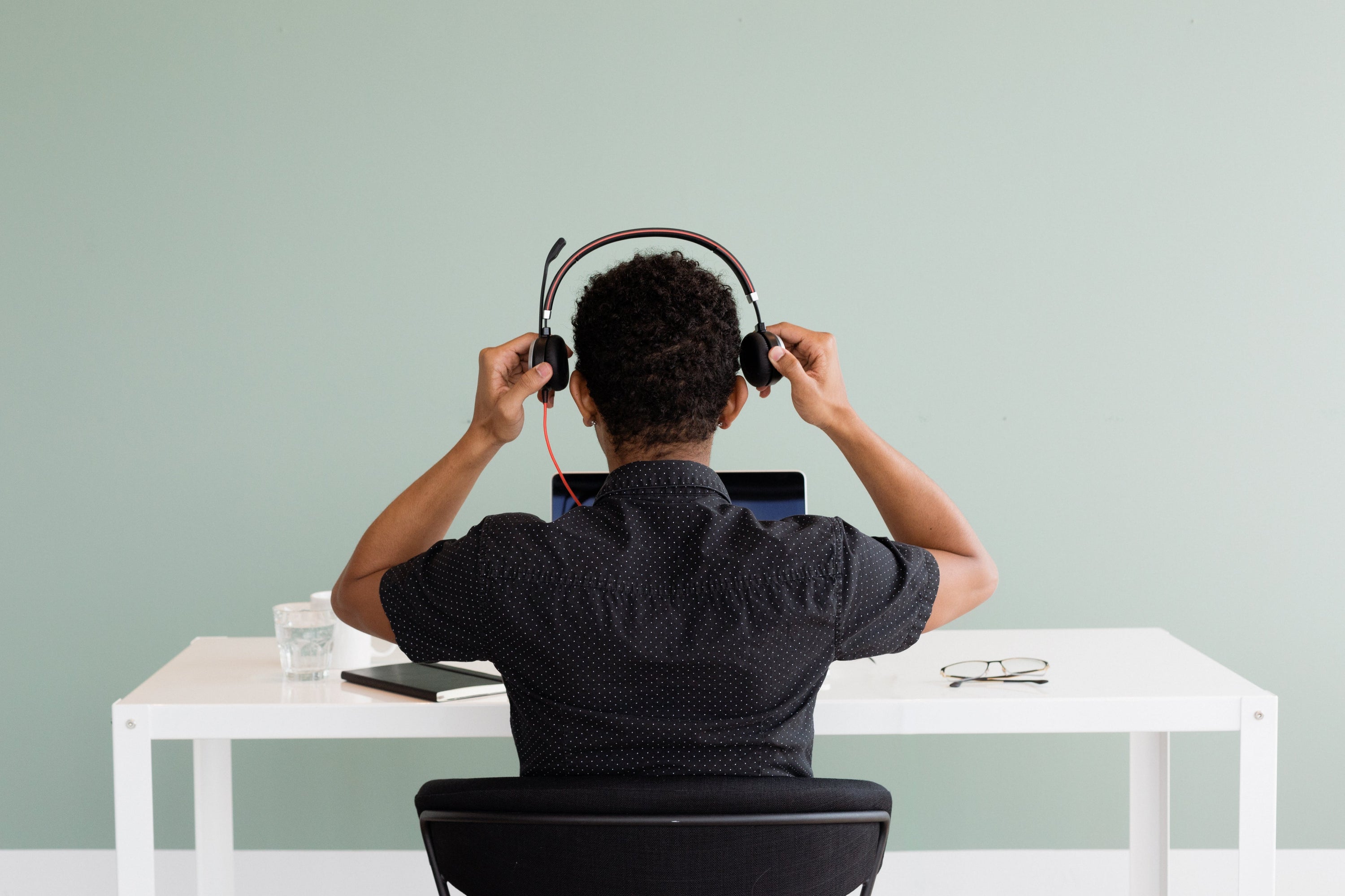 Modern workspace where an employee is set up to answer every client call.