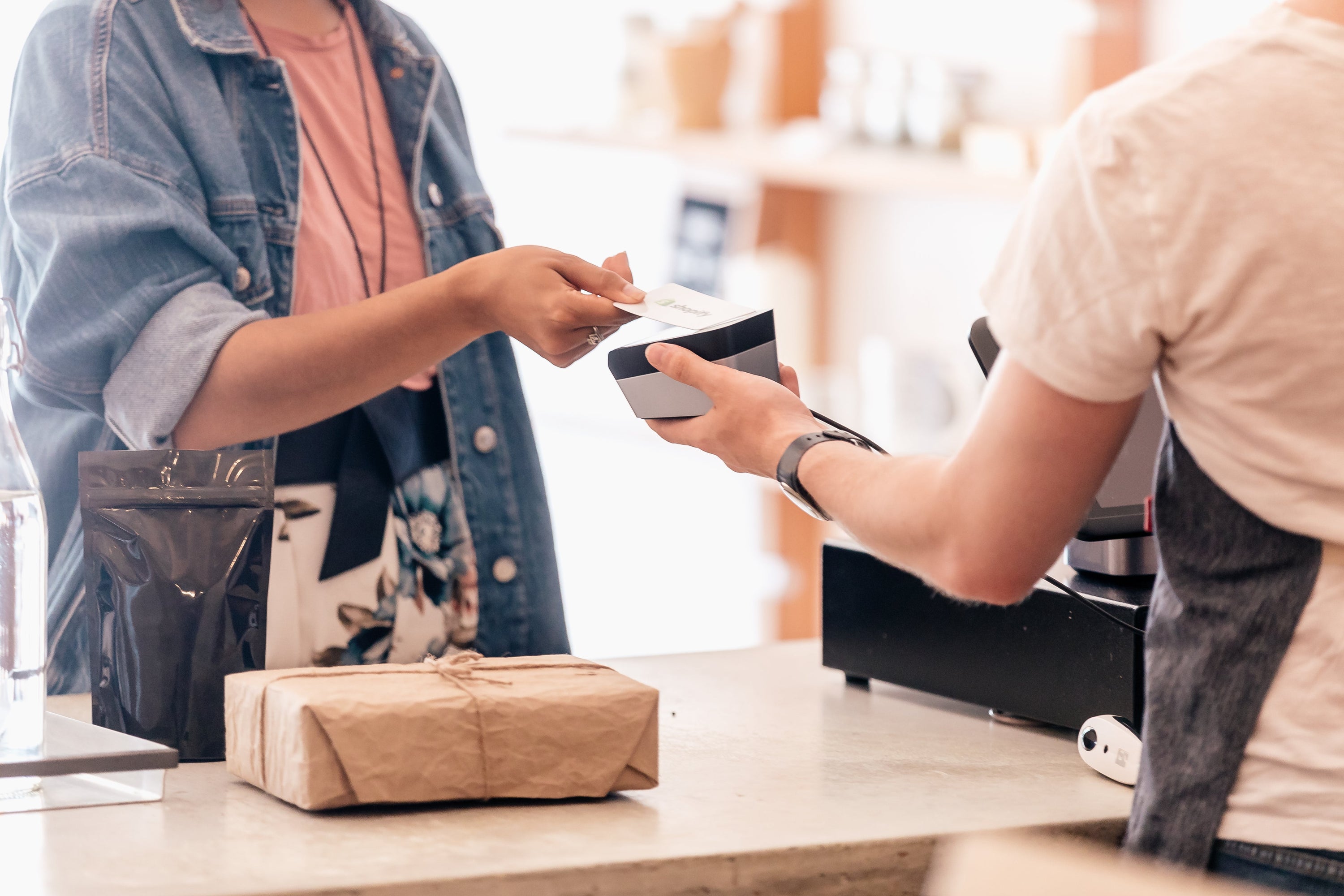 She reaches out with her store card to tap on the payment machine, her products are ready to go.