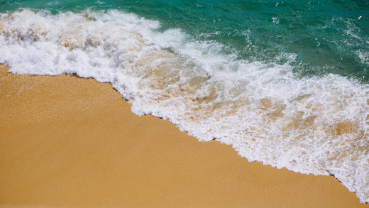 Waves crashing to the shore on a beach.